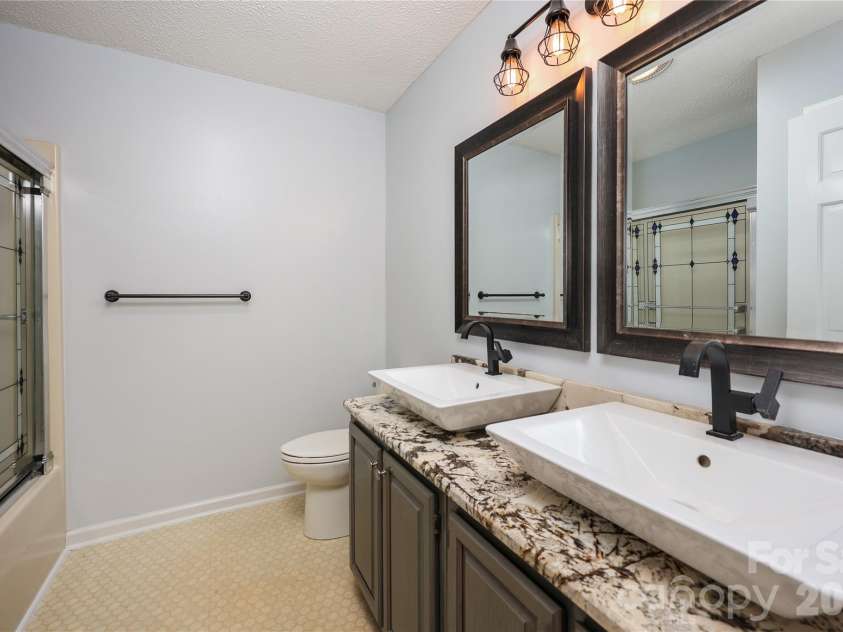 682 Cecil Street, Thomasville, NC 27360.  MLS# CAR4411361, YatesRealty ID 9827. Hall bath