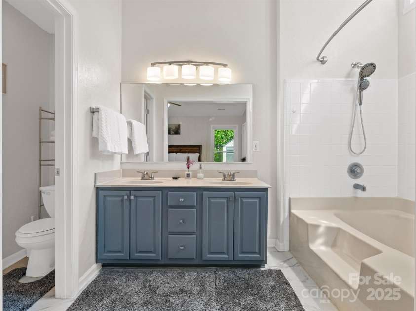 989 Thorncrest Court, Fletcher, NC 28732.  MLS# CAR4253204, YatesRealty ID 9829. Ensuite bathroom in primary bedroom