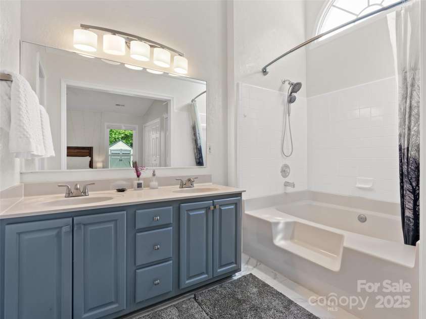 989 Thorncrest Court, Fletcher, NC 28732.  MLS# CAR4253204, YatesRealty ID 9829. Ensuite bathroom in primary bedroom