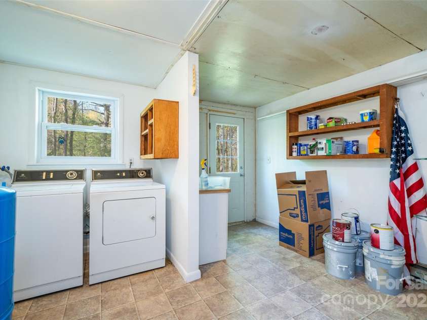 145 Jeter Mountain Road, Hendersonville, NC 28739.  MLS# CAR4281389, YatesRealty ID 984. 13 X 11 Utility room with storage area