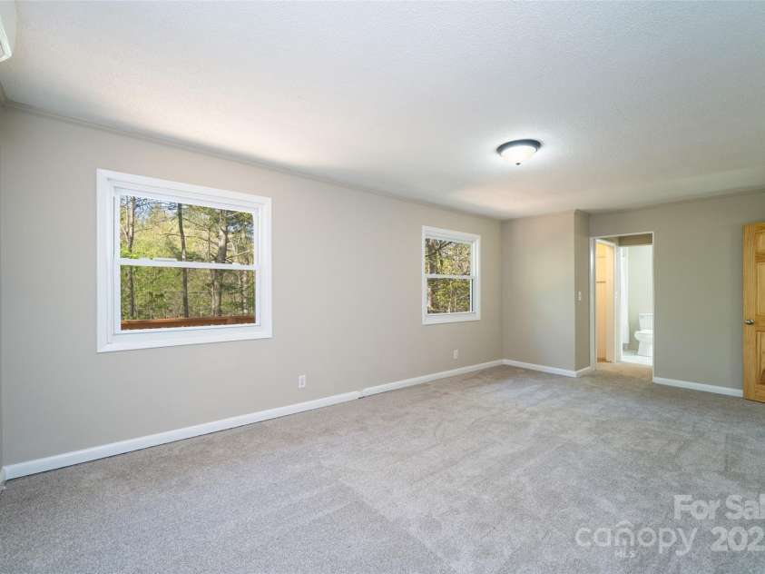 145 Jeter Mountain Road, Hendersonville, NC 28739.  MLS# CAR4281389, YatesRealty ID 984. 20 x 11 Primary Bedroom