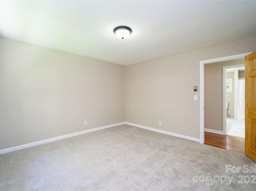 145 Jeter Mountain Road, Hendersonville, NC 28739.  MLS# CAR4281389, YatesRealty ID 984. 2nd bedroom 11.8 X 11