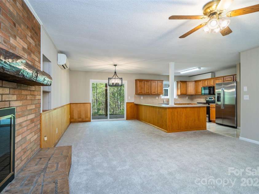 145 Jeter Mountain Road, Hendersonville, NC 28739.  MLS# CAR4281389, YatesRealty ID 984. Gather the family around for a meal and nap by the FP this winter