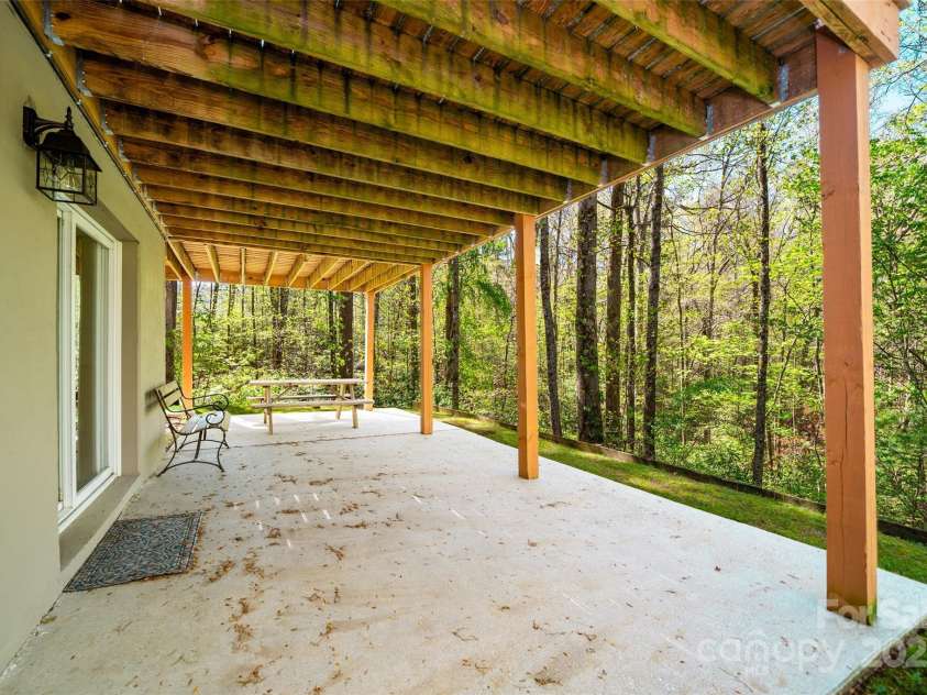 145 Jeter Mountain Road, Hendersonville, NC 28739.  MLS# CAR4281389, YatesRealty ID 984. Large patio for outdoor dining & hammocks 