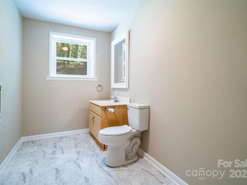 145 Jeter Mountain Road, Hendersonville, NC 28739.  MLS# CAR4281389, YatesRealty ID 984. Lower Level bath