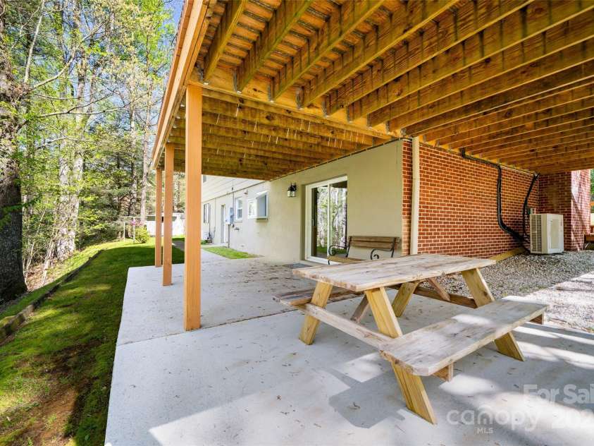 145 Jeter Mountain Road, Hendersonville, NC 28739.  MLS# CAR4281389, YatesRealty ID 984. Picnic in the woods