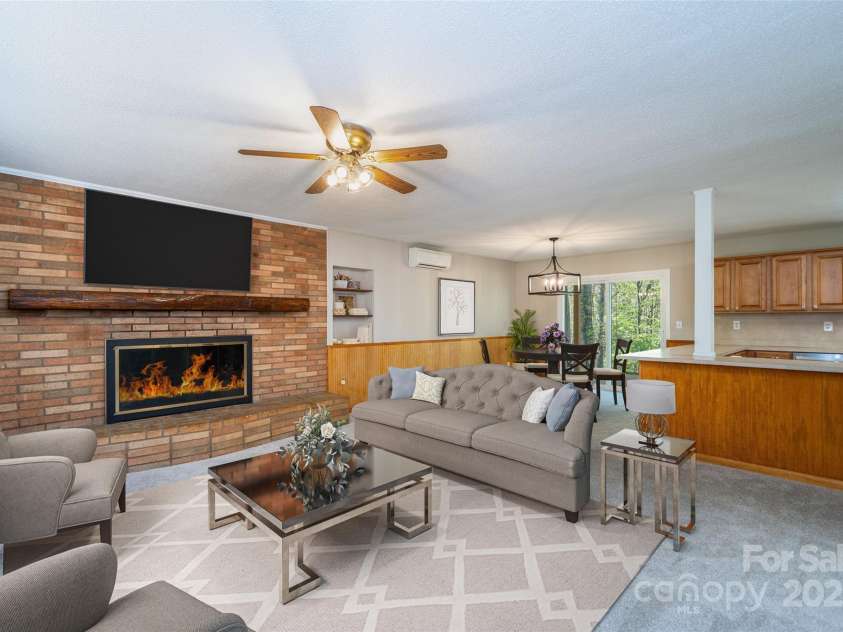 145 Jeter Mountain Road, Hendersonville, NC 28739.  MLS# CAR4281389, YatesRealty ID 984. Staged Kitchen, dining, & LR Enjoy the FP