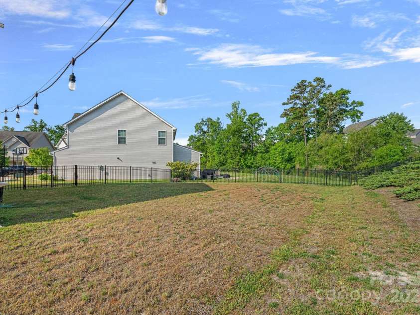 7332 Newsome Court, Concord, NC 28025.  MLS# CAR4253891, YatesRealty ID 9841. Spacious Fenced Yard