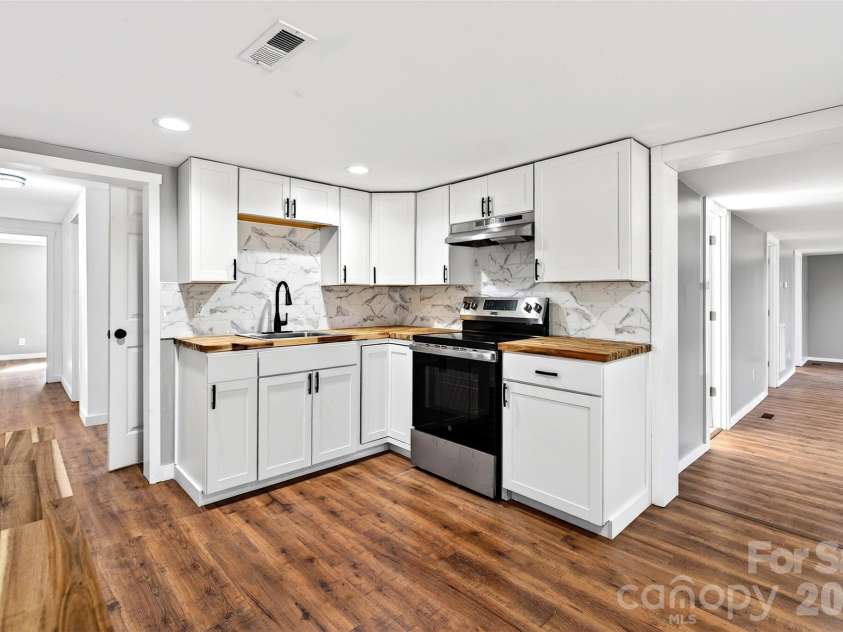 90 Ebenezer Road, Old Fort, NC 28762.  MLS# CAR4351038, YatesRealty ID 9846. Kitchen more cabinets 