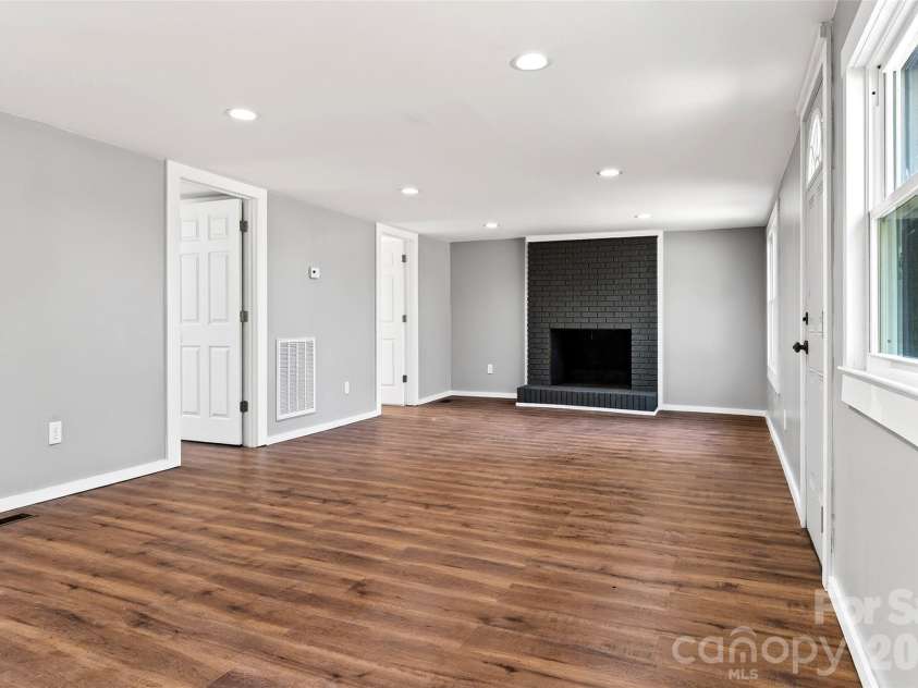 90 Ebenezer Road, Old Fort, NC 28762.  MLS# CAR4351038, YatesRealty ID 9846. Livingroom fireplace 