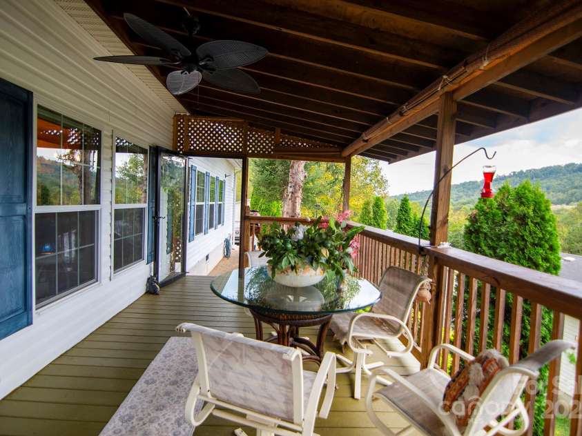 304 Golden Aster Road, Swannanoa, NC 28778.  MLS# CAR4304564, YatesRealty ID 985. Front porch with glass door and roll up shades