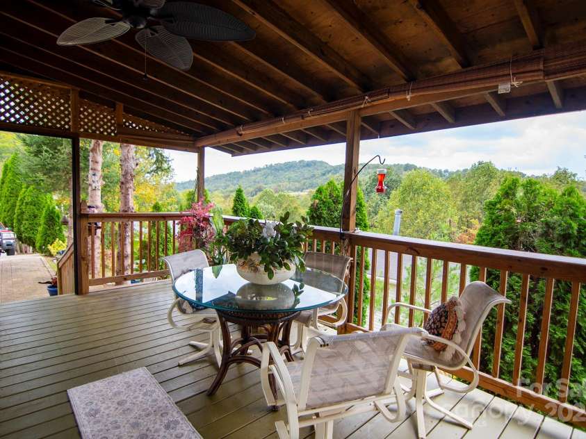 304 Golden Aster Road, Swannanoa, NC 28778.  MLS# CAR4304564, YatesRealty ID 985. Large front porch with mountain views