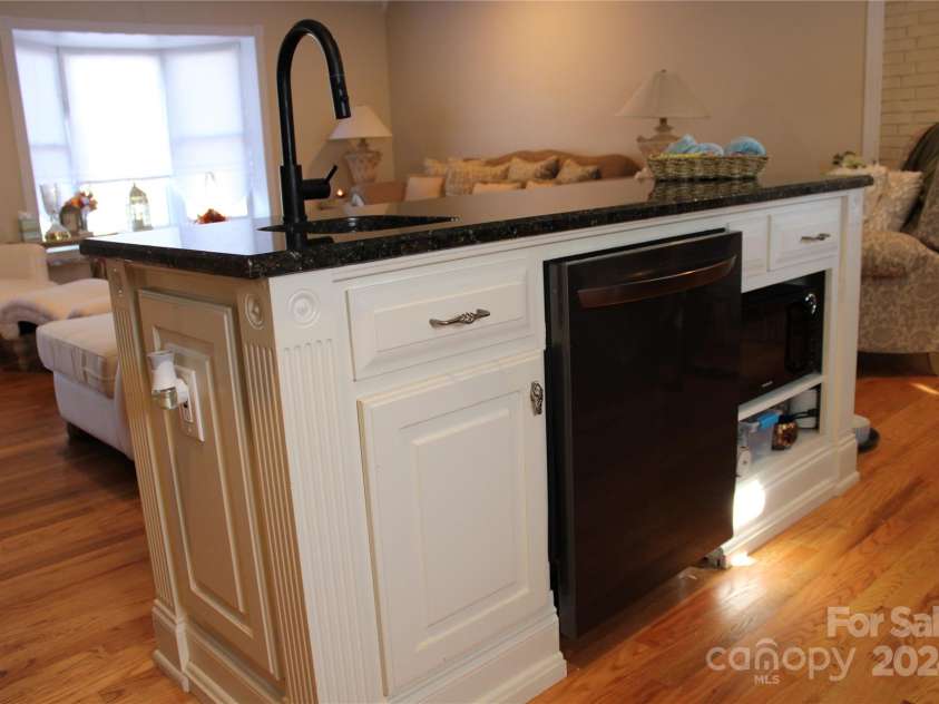 386 Morris Road, Brevard, NC 28712.  MLS# CAR4202834, YatesRealty ID 985. Living Area Flows Into Open Kitchen.  Island with Dishwasher, Microwave and Extra Sink.