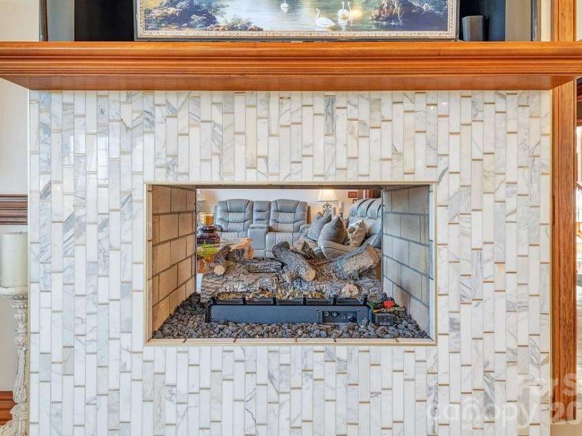 76 Bradford Vistas Drive, Fletcher, NC 28732.  MLS# CAR4335092, YatesRealty ID 9857. 2 sided Fireplace (Kitchen side)