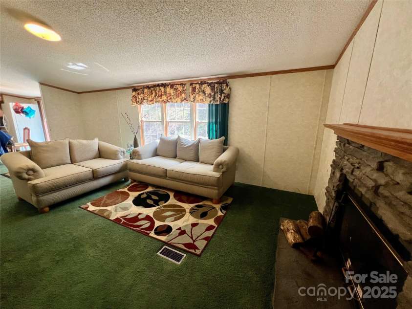 343 Daytona Lane, Saluda, NC 28773.  MLS# CAR4253857, YatesRealty ID 9858. Den