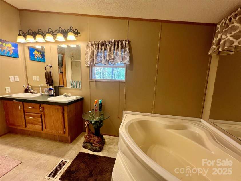 343 Daytona Lane, Saluda, NC 28773.  MLS# CAR4253857, YatesRealty ID 9858. Primary Bathroom