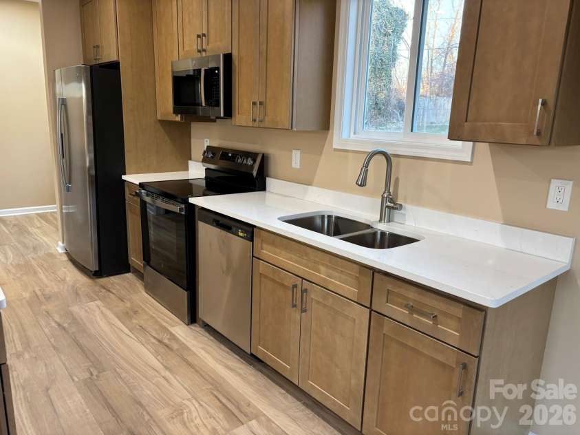 98 Brooklyn Road, Asheville, NC 28803.  MLS# CAR4330787, YatesRealty ID 9860. Custom cabinets and quartz counters. So bright and flows nicely!