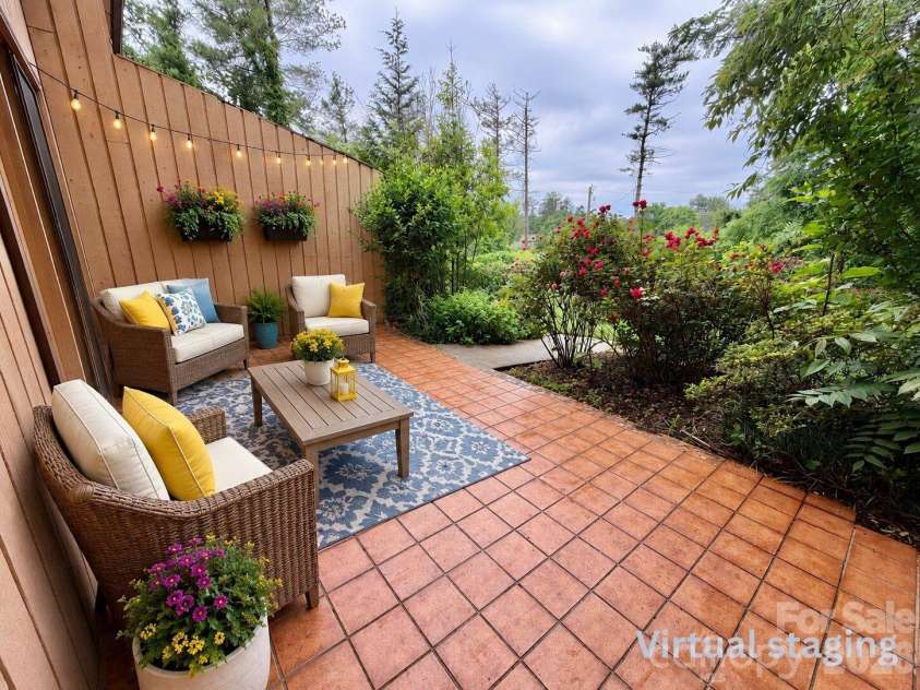 103 Pebble Creek Drive, Asheville, NC 28803.  MLS# CAR4328597, YatesRealty ID 9874. Back patio - virtual staging