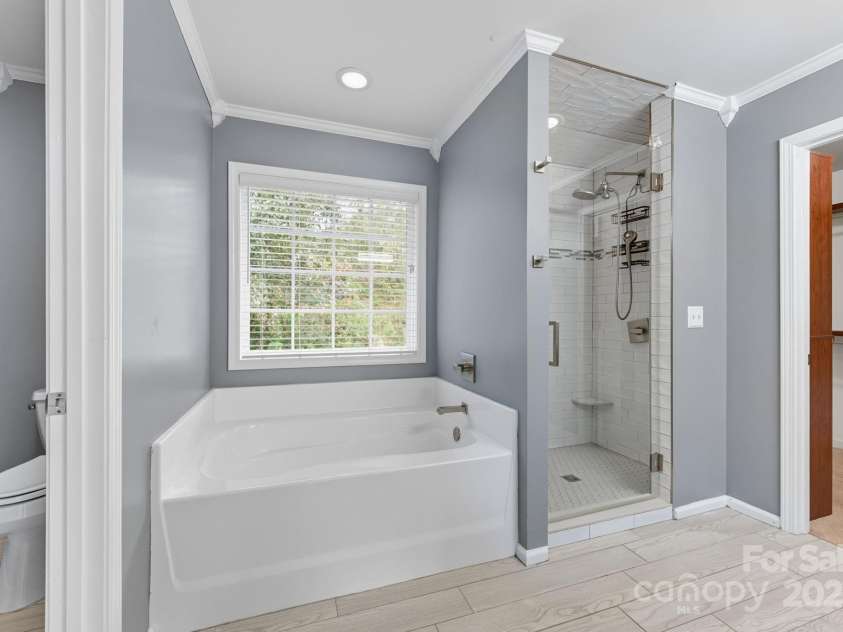 8 River Mead Court, Woodfin, NC 28804.  MLS# CAR4314476, YatesRealty ID 9879. En Suite Primary Bath