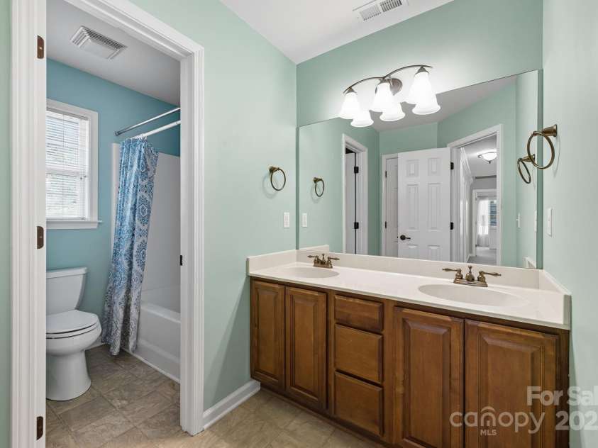 8 River Mead Court, Woodfin, NC 28804.  MLS# CAR4314476, YatesRealty ID 9879. Hall Bathroom