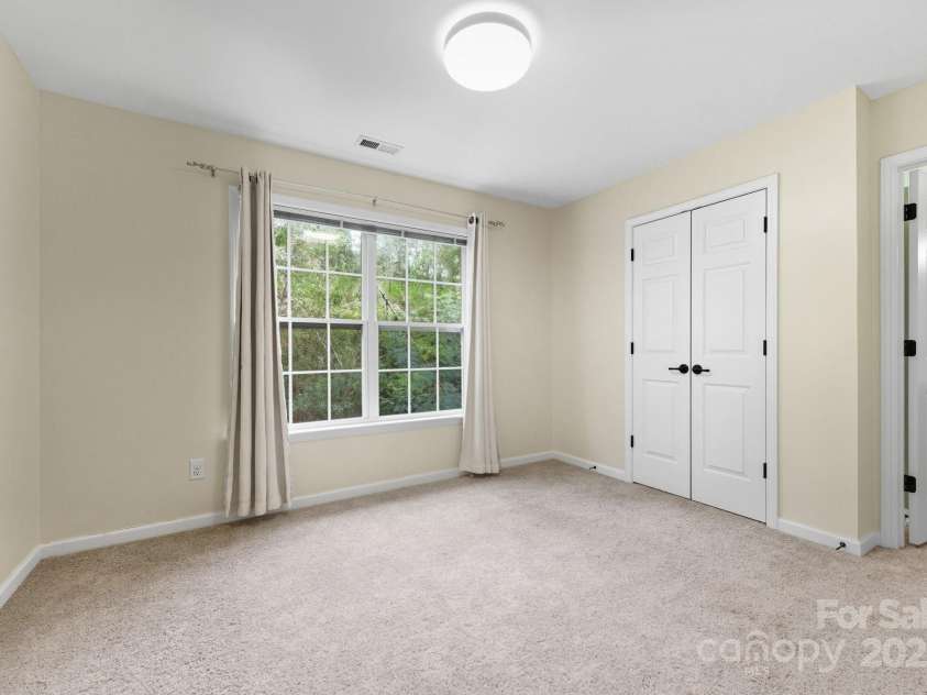 8 River Mead Court, Woodfin, NC 28804.  MLS# CAR4314476, YatesRealty ID 9879. Second Bedroom with bathroom access