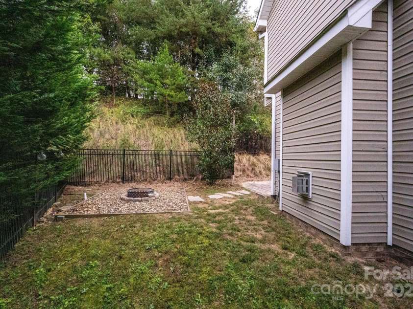 8 River Mead Court, Woodfin, NC 28804.  MLS# CAR4314476, YatesRealty ID 9879. Side Yard
