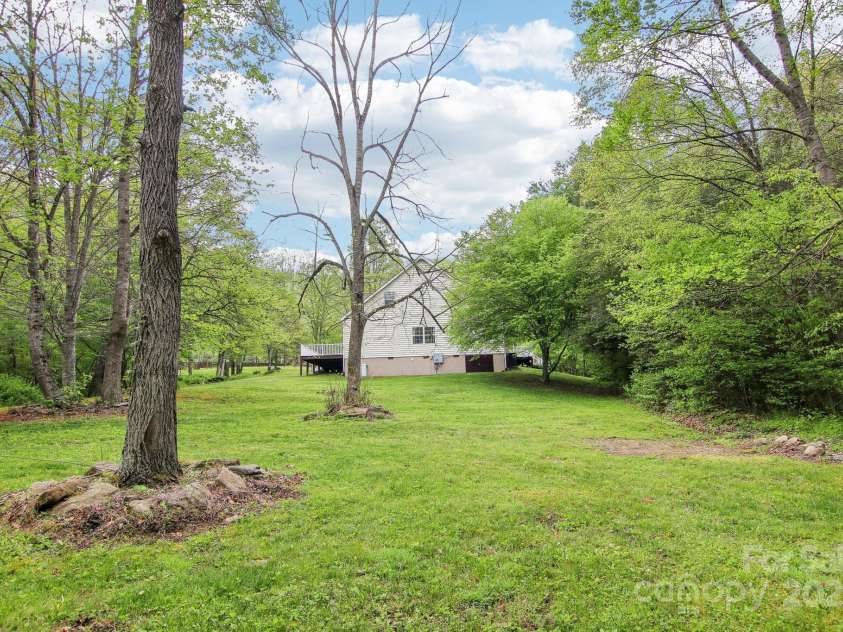 165 Sequoyah Drive, Waynesville, NC 28785.  MLS# CAR4249875, YatesRealty ID 9884. Back of property offers endless possibilities for landscaping or gardening