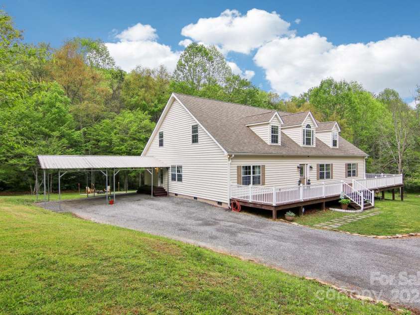 165 Sequoyah Drive, Waynesville, NC 28785.  MLS# CAR4249875, YatesRealty ID 9884. Charming Cape Cod-style home set on 1.4 acres
