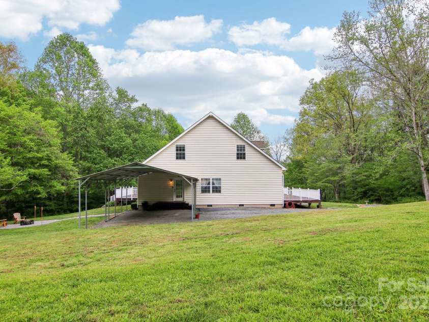 165 Sequoyah Drive, Waynesville, NC 28785.  MLS# CAR4249875, YatesRealty ID 9884. Generous parking space in the carport and driveway