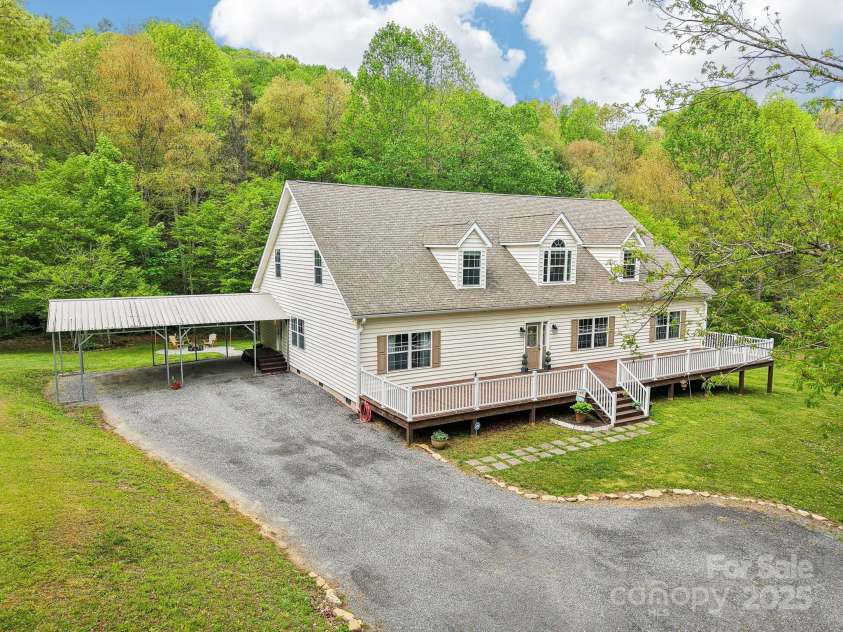165 Sequoyah Drive, Waynesville, NC 28785.  MLS# CAR4249875, YatesRealty ID 9884. Generous parking space in the carport and driveway
