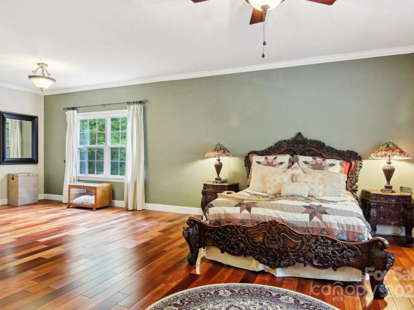 165 Sequoyah Drive, Waynesville, NC 28785.  MLS# CAR4249875, YatesRealty ID 9884. The spacious primary bedroom is filled with tons of natural light, creating a warm and inviting retreat