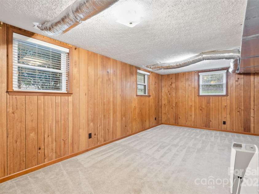 25 Pisgah Shadows Way, Hendersonville, NC 28739.  MLS# CAR4206550, YatesRealty ID 9897. Downstairs Bonus Room