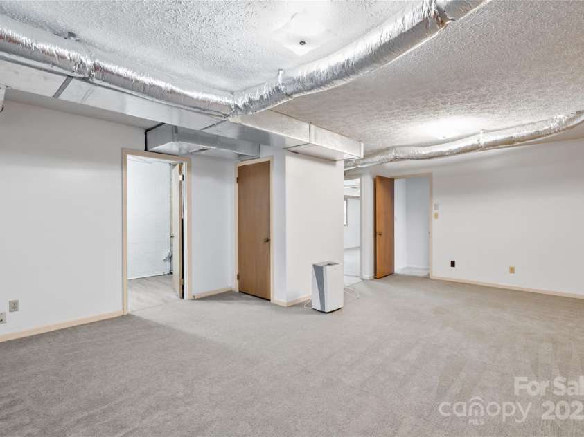 25 Pisgah Shadows Way, Hendersonville, NC 28739.  MLS# CAR4206550, YatesRealty ID 9897. Downstairs Bonus Room