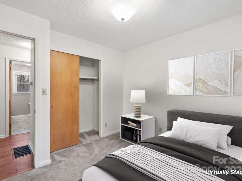 25 Pisgah Shadows Way, Hendersonville, NC 28739.  MLS# CAR4206550, YatesRealty ID 9897. Virtually Staged Bedroom 3 (as a bedroom). This image has been virtually staged. Furniture placement is for visual inspiration and may not reflect actual dimensions or scale.