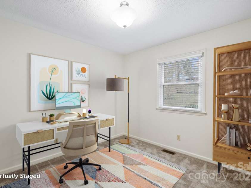 25 Pisgah Shadows Way, Hendersonville, NC 28739.  MLS# CAR4206550, YatesRealty ID 9897. Virtually Staged Bedroom 3 (as a home office). This image has been virtually staged. Furniture placement is for visual inspiration and may not reflect actual dimensions or scale.