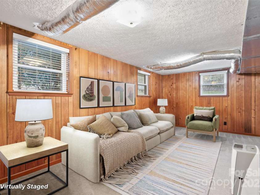 25 Pisgah Shadows Way, Hendersonville, NC 28739.  MLS# CAR4206550, YatesRealty ID 9897. Virtually Staged - Bonus Room. This image has been virtually staged. Furniture placement is for visual inspiration and may not reflect actual dimensions or scale.