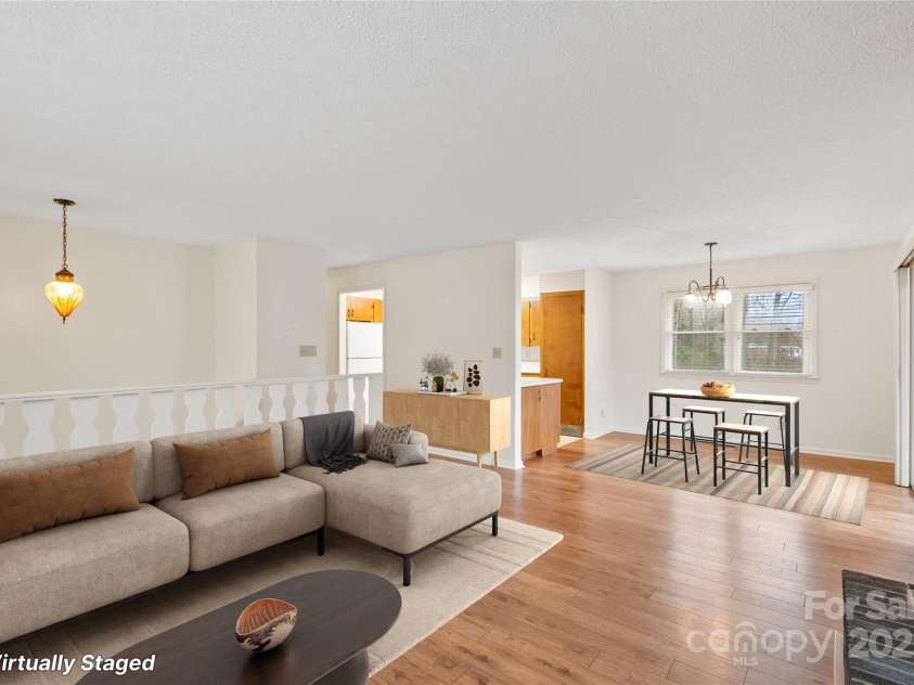 25 Pisgah Shadows Way, Hendersonville, NC 28739.  MLS# CAR4206550, YatesRealty ID 9897. Virtually Staged Livingroom. This image has been virtually staged. Furniture placement is for visual inspiration and may not reflect actual dimensions or scale.