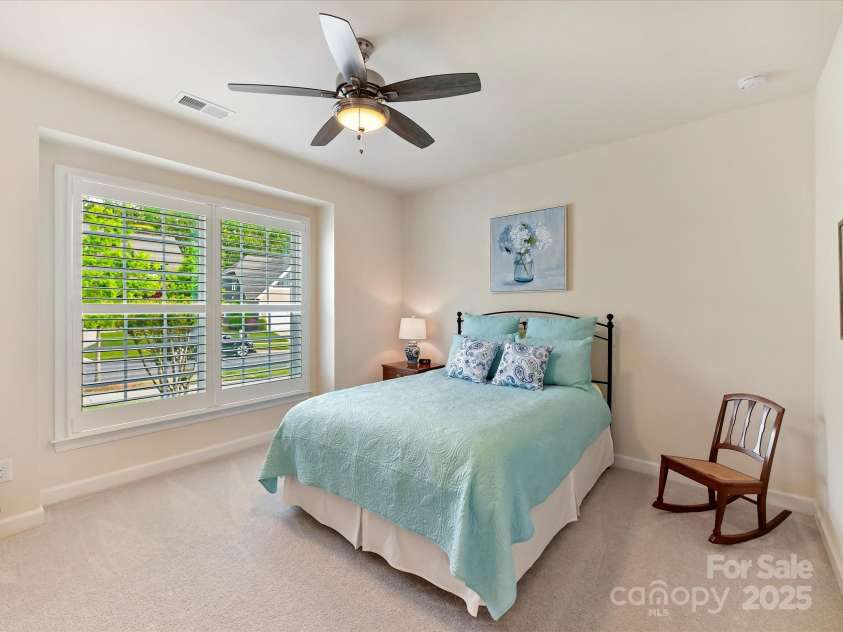 4989 Samoa Ridge Drive, Lancaster, SC 29720.  MLS# CAR4243510, YatesRealty ID 9898. Bedroom 2 with Ceiling Fan and Plantation Shutters