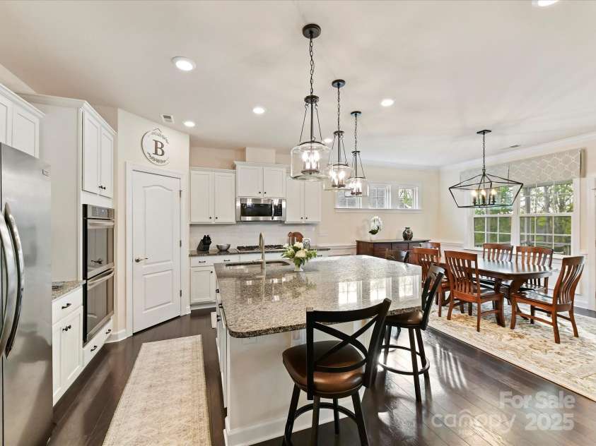 4989 Samoa Ridge Drive, Lancaster, SC 29720.  MLS# CAR4243510, YatesRealty ID 9898. Wide plank Wood Flooring in Kitchen/Breakfast Rm. Pantry with Solid Shelving. Roll-out Shelving in all Base Kitchen Cabinets