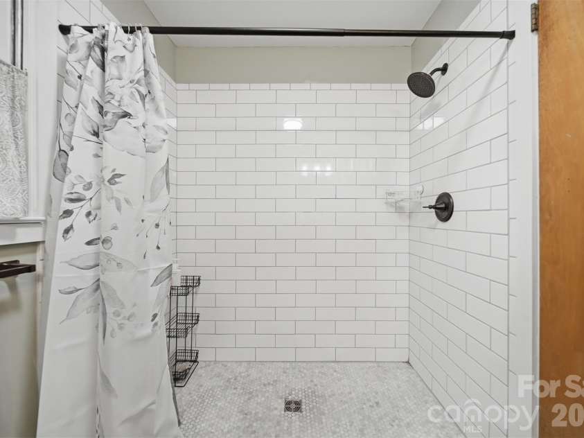 35 32nd Avenue, Hickory, NC 28601.  MLS# CAR4365663, YatesRealty ID 9899. Tiled shower upstairs