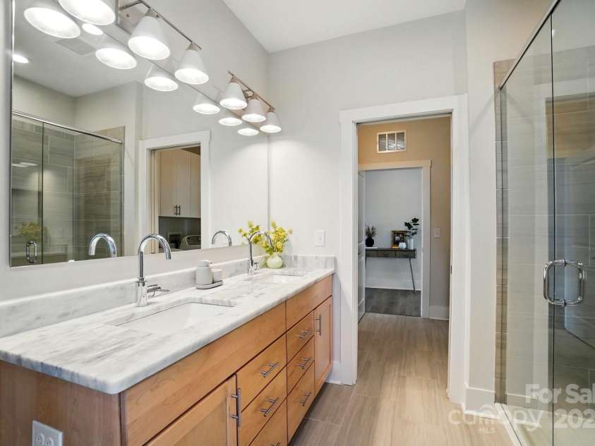 1116 Brooksland Place, Waxhaw, NC 28173.  MLS# CAR4249949, YatesRealty ID 9900. Primary Bathroom with pocket door to laundry room!