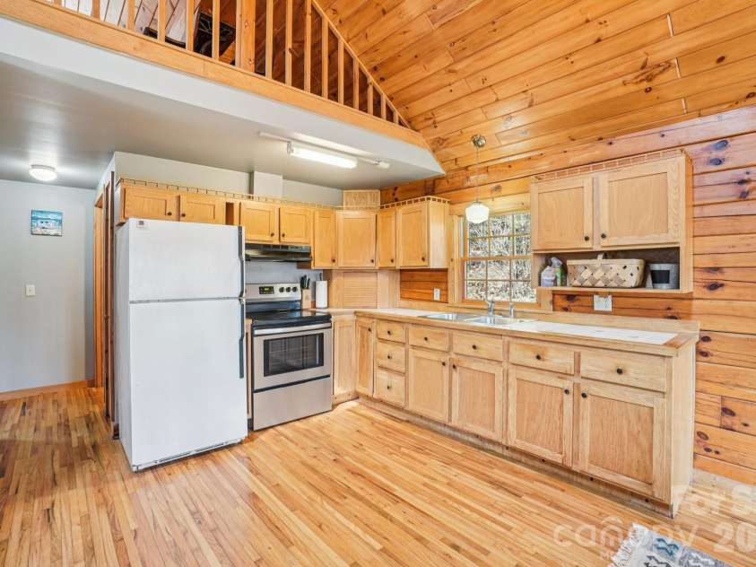 307 Roaring Creek Lane, Waynesville, NC 28786.  MLS# CAR4353310, YatesRealty ID 9914. Functional kitchen with convenient layout and natural light.