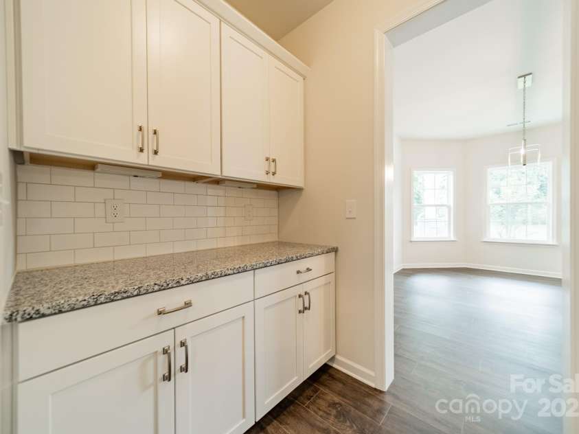 6034 Jepson Court, Charlotte, NC 28214.  MLS# CAR4292167, YatesRealty ID 9915. Butlers Pantry into Dining Room