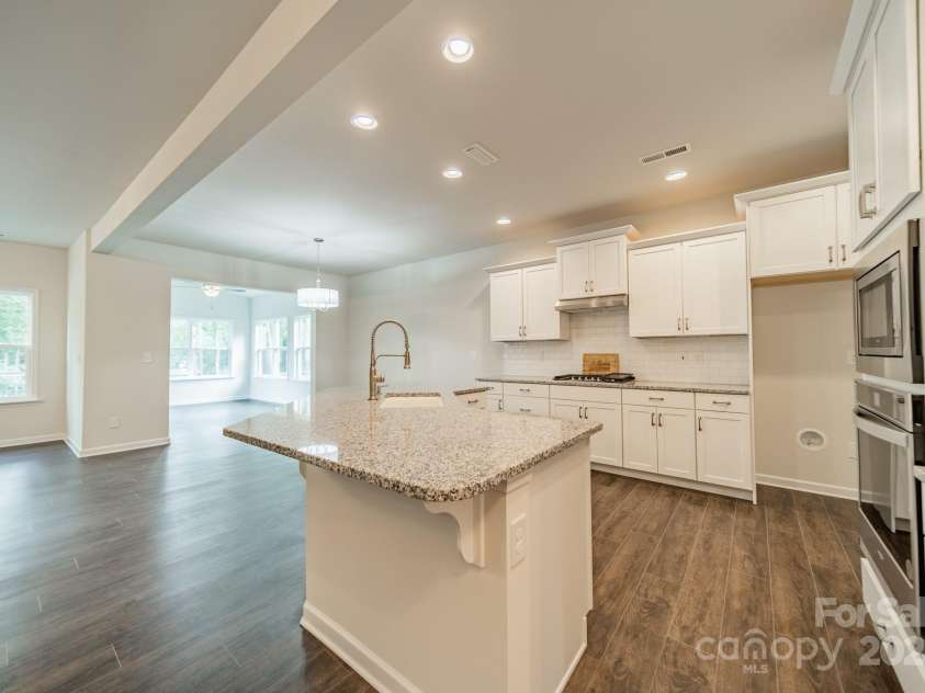 6034 Jepson Court, Charlotte, NC 28214.  MLS# CAR4292167, YatesRealty ID 9915. Kitchen & Breakfast nook into sunroom