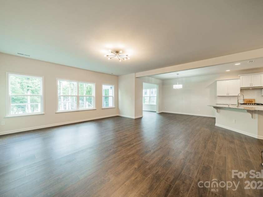 6034 Jepson Court, Charlotte, NC 28214.  MLS# CAR4292167, YatesRealty ID 9915. Living Room into kitchen & dining area