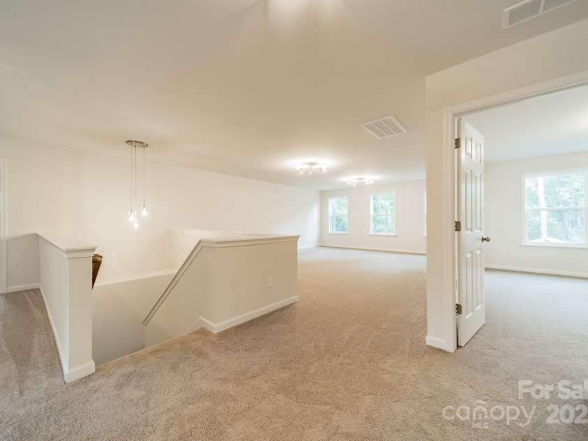 6034 Jepson Court, Charlotte, NC 28214.  MLS# CAR4292167, YatesRealty ID 9915. Upstairs loft landing