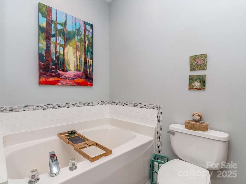 1141 Hollyheath Lane, Charlotte, NC 28209.  MLS# CAR4234094, YatesRealty ID 9923. Primary bath with tub and walk-in shower