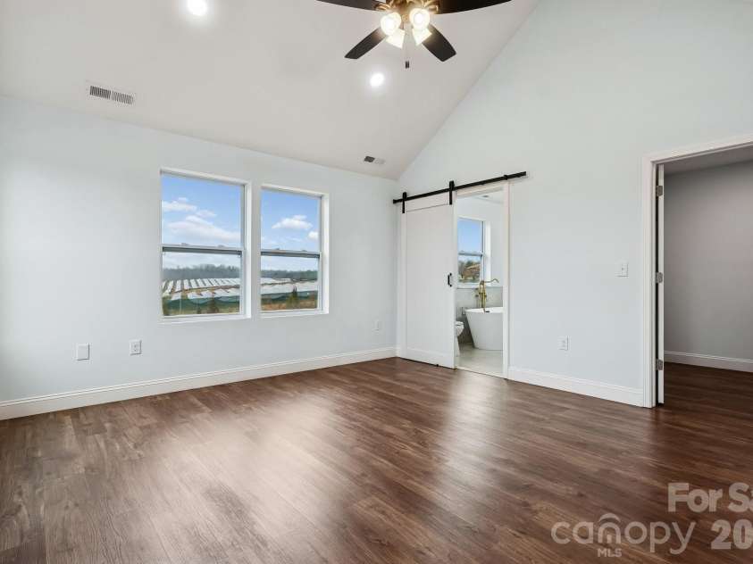 114 Strawberry Court, Lincolnton, NC 28092.  MLS# CAR4352512, YatesRealty ID 9926. Primary bedroom on second level with cathedral ceiling, ceiling fan and recessed lighting