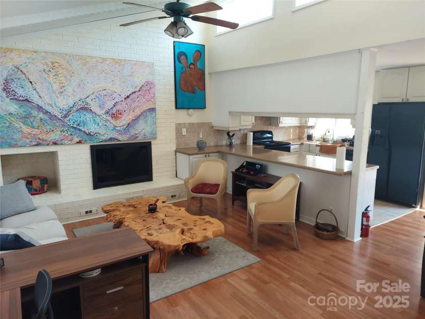 8015 Sullivan Drive, Charlotte, NC 28215.  MLS# CAR4223466, YatesRealty ID 9926. Closer look of living space which is open to kitchen and dining areas.