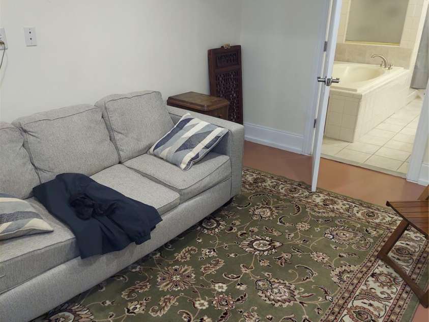 8015 Sullivan Drive, Charlotte, NC 28215.  MLS# CAR4223466, YatesRealty ID 9926. Lower level sitting room at full bath area.